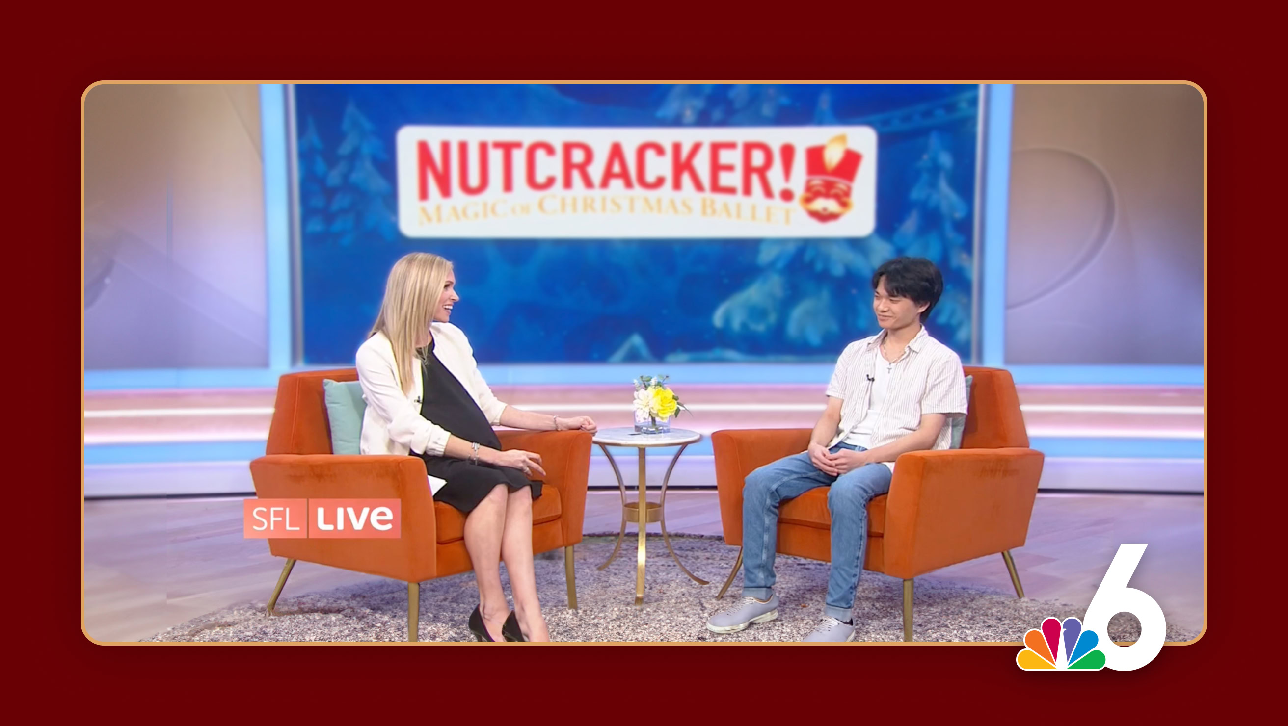 Two people seated in orange chairs on a tv set for Channel 6 news, having a conversation, with a blue background displaying the Nutcracker logo.