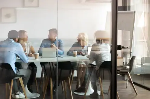 A group of people in a conference room.