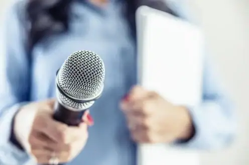 A person holding a microphone.