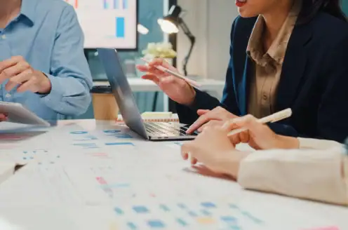 A group of people in a work meeting.